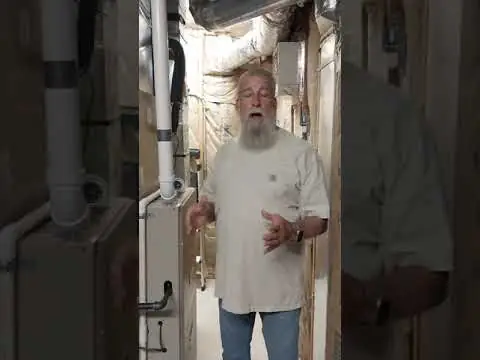Climate Control Master customer sharing a video review beside his HVAC equipment